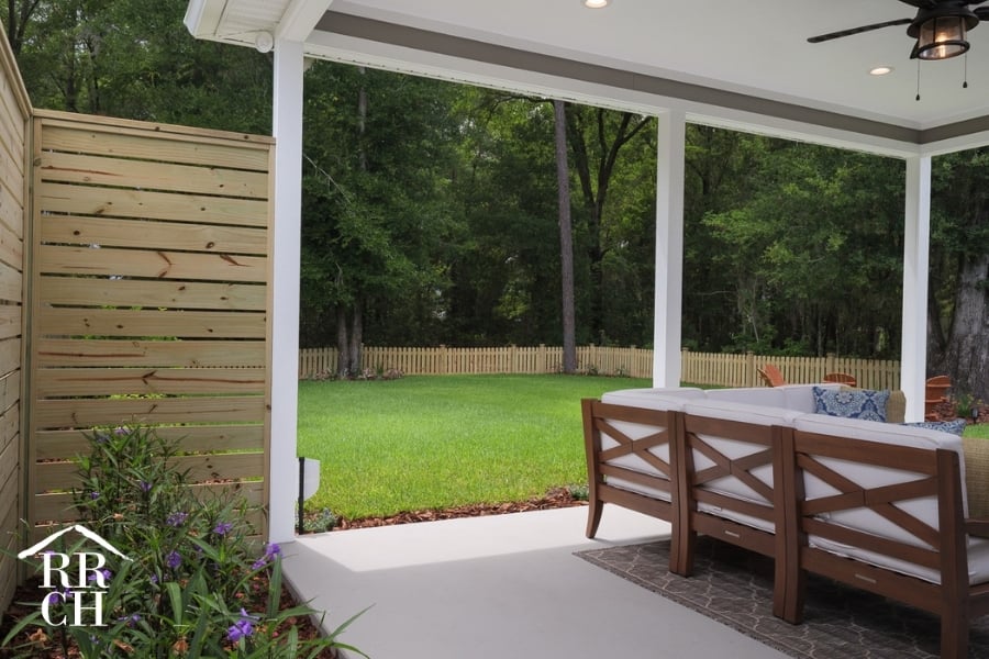 Custom Home Build Longleaf Backyard with Outdoor Living Area | Robinson Renovation & Custom Homes, Inc.