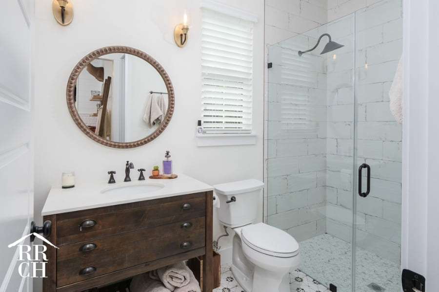Custom Home Build Extra Bathroom Modern Farmhouse Style Accent Mirror and Fixtures - Dylans Grove 2 | Robinson Renovation & Custom Homes, Inc.